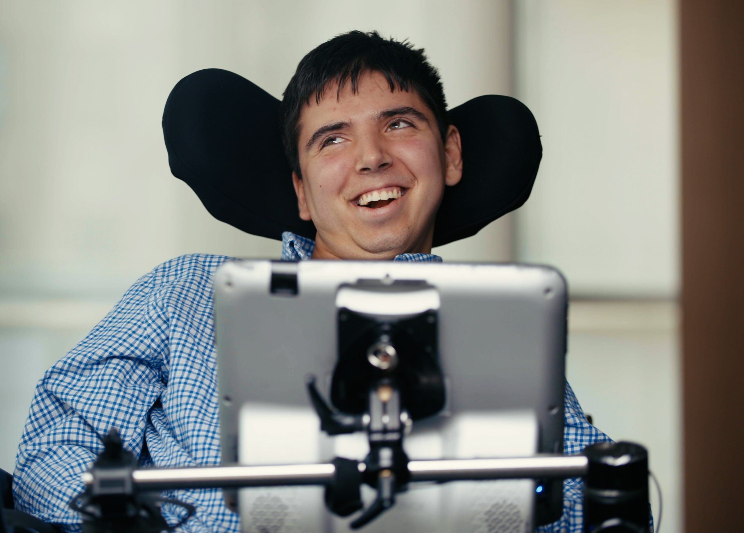 Tech innovators and disability advocates collaborating in a modern workspace, brainstorming inclusive solutions for accessible cities.